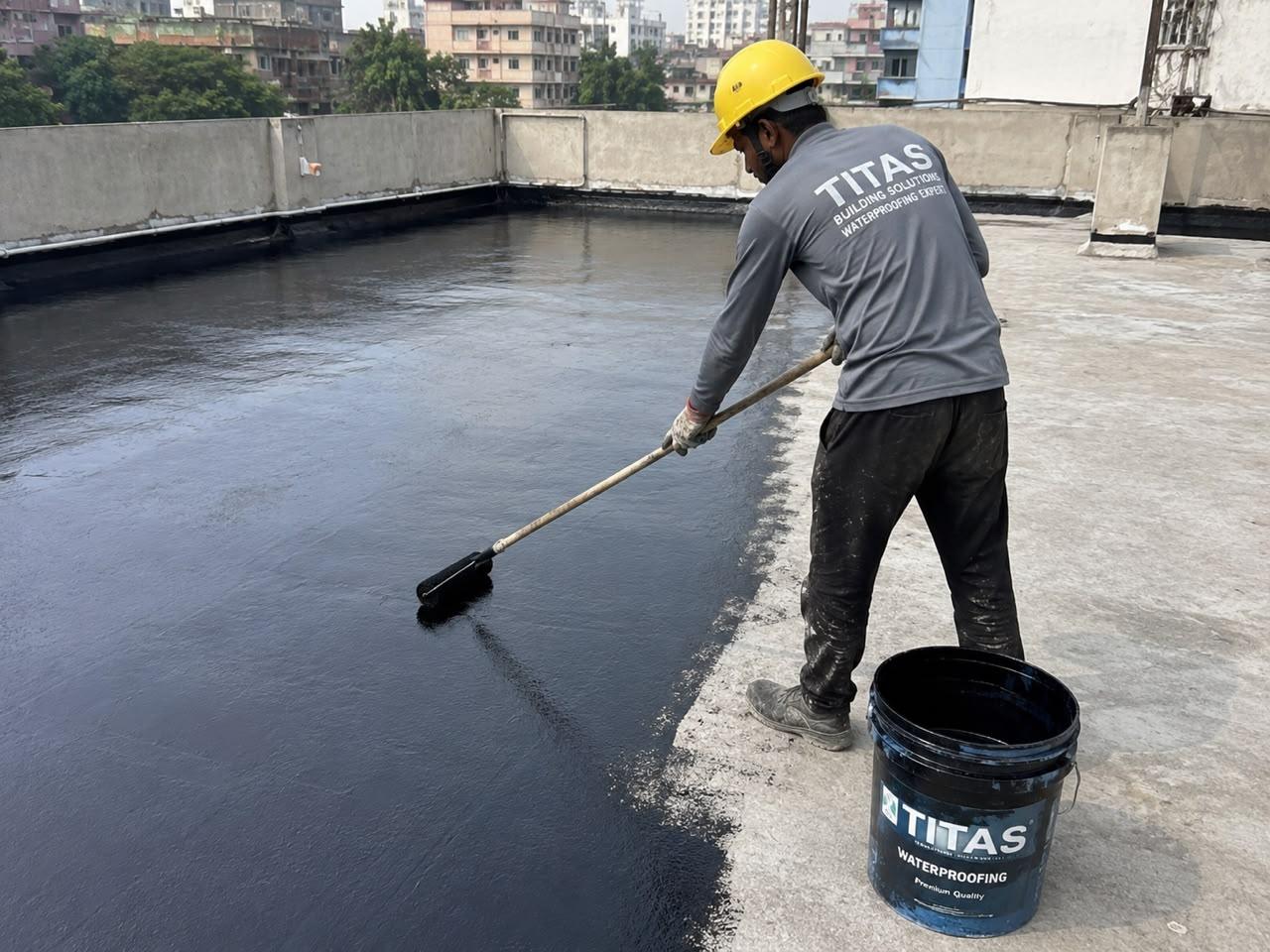 Titas team completing terrace waterproofing on a Kolkata rooftop